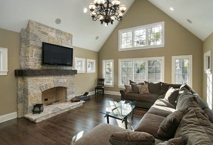 Luxury home with a stone fireplace typical of real estate in West Wind, Lexington